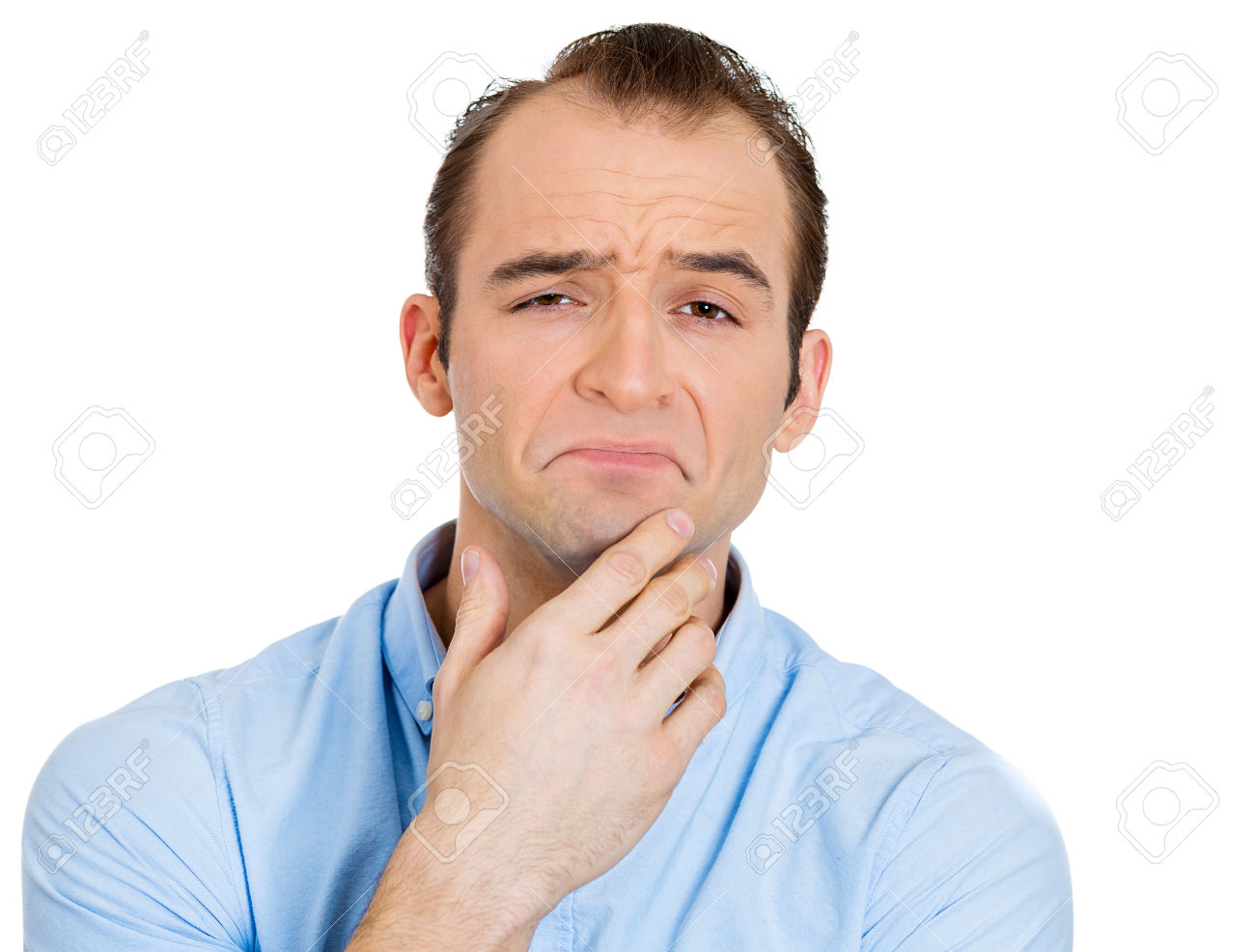 Closeup portrait of skeptical guy, business man looking suspicious, assessing situation, face full of disapproval, isolated on white background. Negative human emotions, facial expressions, feelings